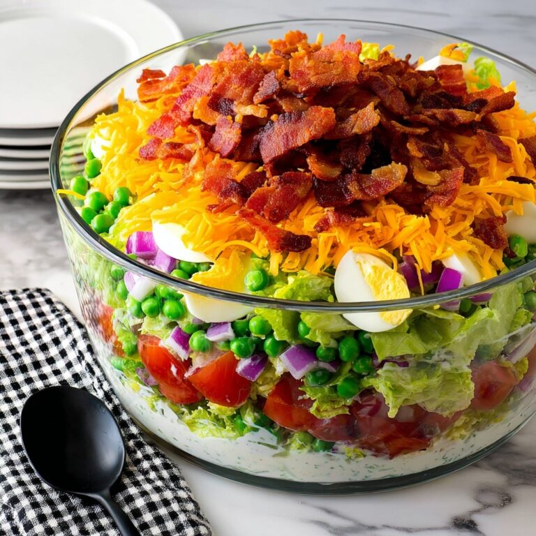Layer Salad with Bacon, Eggs, Tomatoes, Cheese, and Green Peas Recipe